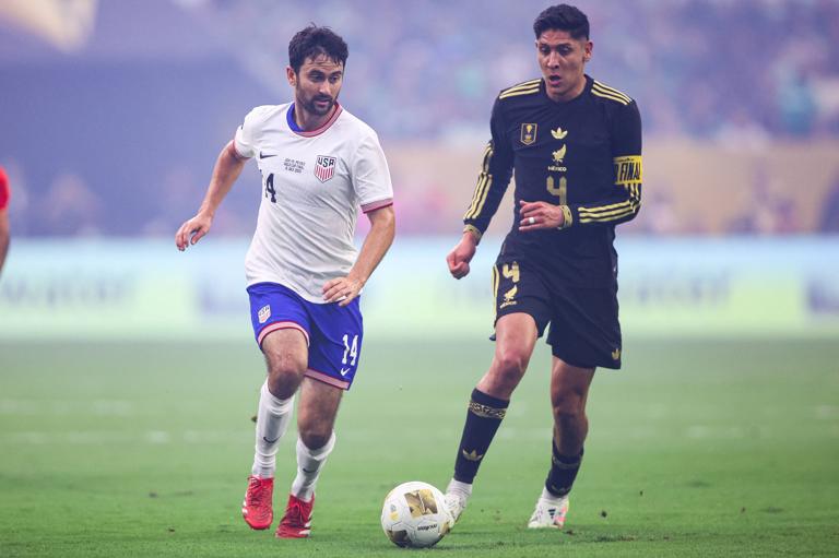 Edson Álvarez of Mexico competes with Luca de la Torre of the United States for possession during the 2025 CONCACAF Gold Cup final between Mexico and the USA.